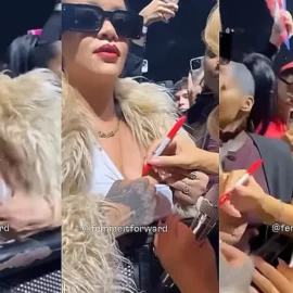 Mariah Carey firma un autógrafo en el pecho de Rihanna durante un concierto de Navidad